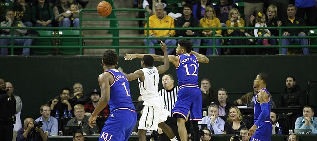 Kansas guard Kelly Oubre Jr. (12) swats at an inbound pass to force a turnover by Baylor with seconds remaining in regulation on Wednesday, Jan. 7, 2014 at Ferrell Center in Waco, Texas.