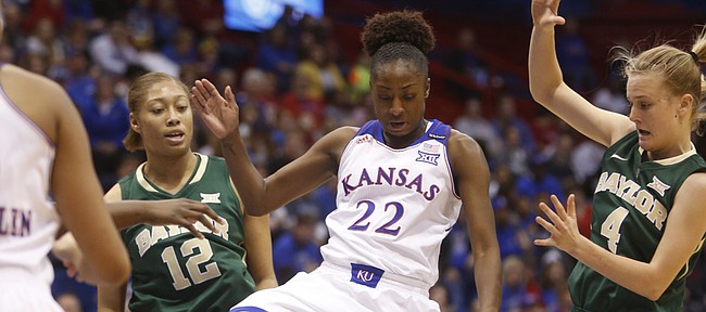 Kansas freshman Chayla Cheadle (22) loses the ball against Baylor's defense in the Jayhawks' 71-63 loss to Baylor on Saturday, Jan. 17, 2015, in Allen Fieldhouse.