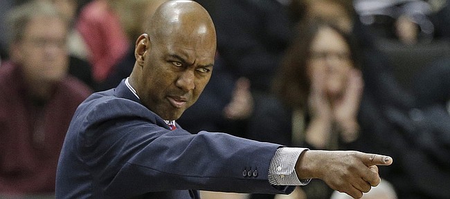 Wake Forest head coach Danny Manning directs his team against Georgia Tech during the first half of an NCAA college basketball game in Winston-Salem, N.C., Saturday, Jan. 10, 2015. (AP Photo/Chuck Burton)
