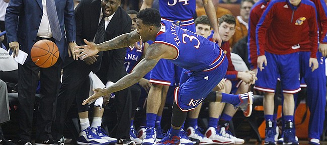 Kansas forward Jamari Traylor (31) dives out of bounds for an attempted save before the Jayhawks' bench during the first half, Saturday, Jan. 24, 2015 at Frank Erwin Center in Austin, Texas.