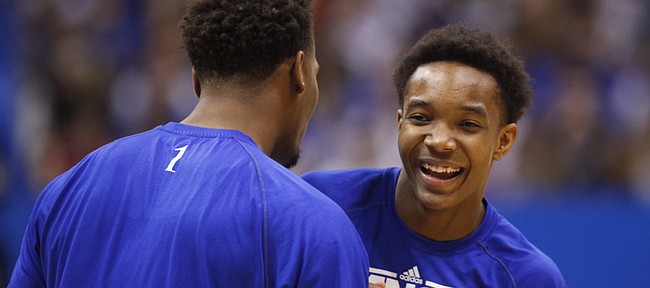 Kansas players Devonte Graham, right, and Wayne Selden clown around during warmups prior to tipoff against Oklahoma on Monday, Jan. 19, 2015 at Allen Fieldhouse.