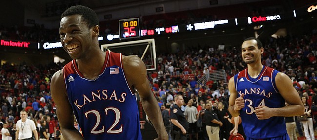 Kansas guard Andrew Wiggins flashes a wide smile after getting a bucket with seconds left to life the Jayhawks over Texas Tech 64-63 on Tuesday, Feb. 18, 2014 at United Spirit Arena in Lubbock, Texas. At right is Kansas forward Perry Ellis.
