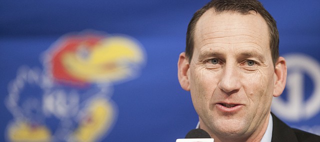 Kansas University football coach David Beaty talks with media members about his committed recruits on signing day, Wednesday, Feb. 4, 2015 in Mrkonic Auditorium.