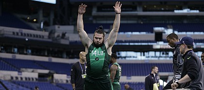 Kansas University linebacker Ben Heeney jumps during a drill at the NFL football scouting combine Sunday, Feb. 22, 2015, in Indianapolis.