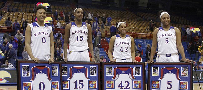 KU seniors, from left, Asia Boyd, Chelsea Gardner, Natalie Knight and Bunny Williams are honored as part of Senior Night on Monday, March 2, 2015, at Allen Fieldhouse.