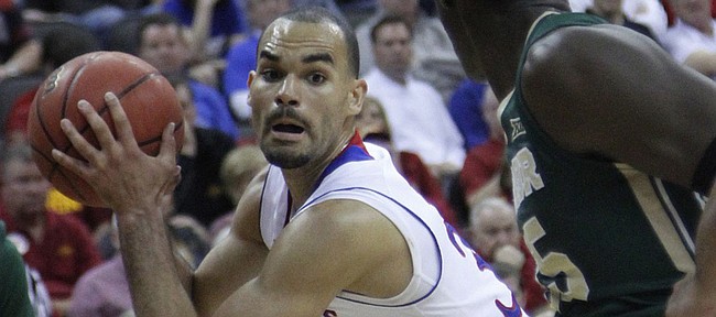 Perry Ellis (34) positions himself for a shot against Baylor's defense in the Jayhawk’s 62-52 win over Baylor in the semi-final of the Big 12 Tournament Friday. 