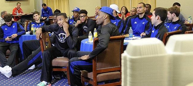 Members of the Kansas University men's basketball team watch the unveiling of this year's NCAA Tournament field Sunday, March 15, 2015, in the Naismith Room on the second floor of Allen Fieldhouse. The Jayhawks earned a No. 2 seed in the Midwest Region and will open play against No. 15 seed New Mexico State on Friday in Omaha, Nebraska.