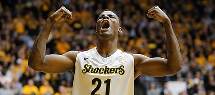 Wichita State center Bush Wamukota celebrates a turnover committed by Northern Iowa during the first half of their college basketball game at Koch Arena in Wichita, Kan., on Saturday, Feb. 28, 2015. Wichita State went on to win 74-60 to win their second straight Missouri Valley Conference title.
