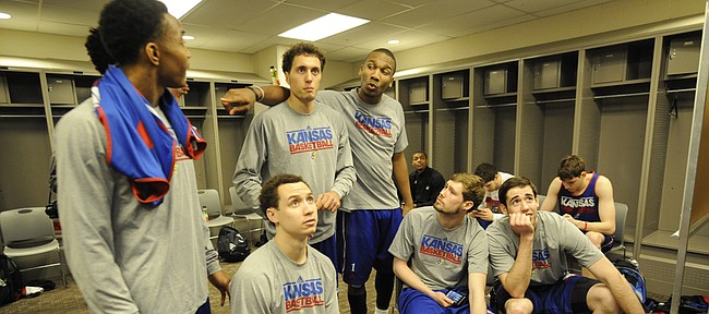 Kansas players watch an NCAA Tournament game on TV in their locker room  Saturday, March 21, 2015 at the CenturyLink Center, Omaha, Neb. 