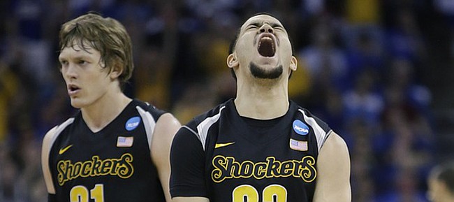 Wichita State guard Fred VanVleet (23) celebrates after hitting a 3-point-basket to give the Shockers a 3-point lead before half-time in the Jayhawks' third-round NCAA Tournament game against Wichita State Sunday, March 22, 2015 at the CenturyLink Center, Omaha, Neb.