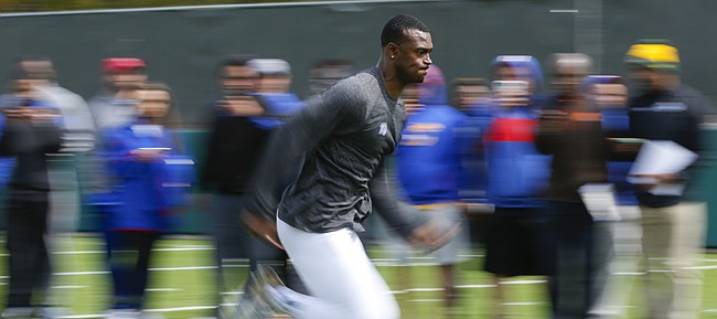 Former Kansas cornerback JaCorey Shepherd sprints to the finish of a timed 40 yard dash during Pro Day on Wednesday, March 25, 2015.