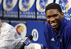 Kansas center Joel Embiid smiles along side head basketball coach Bill Self as he talks with media members during a news conference on Wednesday, April 9, 2014 at Allen Fieldhouse in Lawrence, Kan. Embiid announced his intention to enter the 2014 NBA Draft. (AP PHOTO/Nick Krug/Lawrence Journal-World)