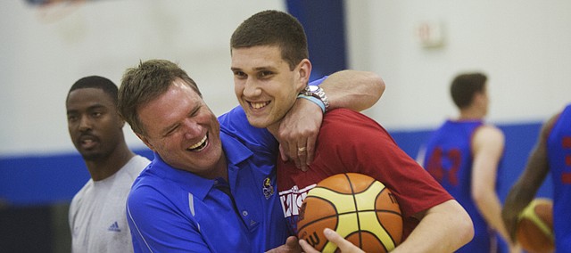 KU coach Bill Self, left, jokes with Svi Mykhailiuk as Self said he hadn't seen Svi for a while, just before camp on Tuesday, June 9, 2015.