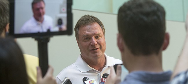 Kansas University basketball coach Bill Self answers questions Monday after practice. Self said his Jayhawks are learning to adapt to international rules in preparation for representing the United States in the World University Games in Gwangju, South Korea.