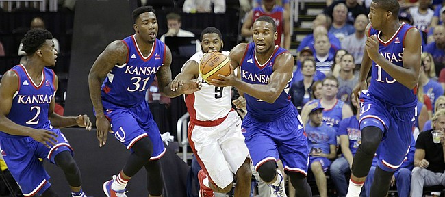 Kansas guard Wayne Selden Jr. (1) starts a fast break with teammates from left, LaGerald Vick (2), Jamari Traylor (31) Selden and Carlton Bragg (15) during a 91-83 Team USA exhibition game win against Canada Tuesday, June 23, at the Sprint Center in K.C., MO.
