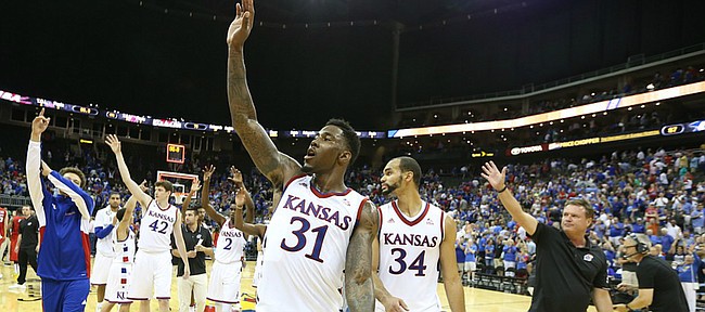 Kansas forward Jamari Traylor (31) and his teammates and coaches wave to the Jayhawk fans following the Jayhawks' 87-76 win over Team Canada in Friday's World University Games exhibition at Sprint Center.