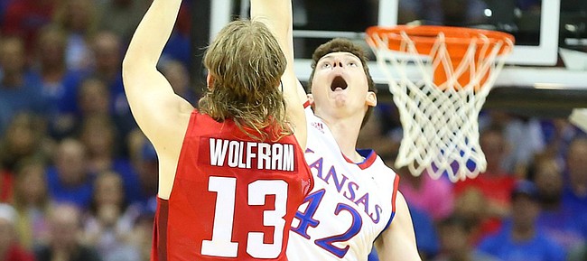 Kansas forward Hunter Mickelson (42) gets up to defend against a shot from Team Canada forward Josh Wolfram (13) during the third quarter of Friday's World University Games exhibition at Sprint Center.