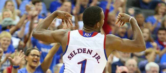 Kansas guard Wayne Selden Jr. (1) flexes before the crowd after a three during the second quarter of Friday's World University Games exhibition at Sprint Center.