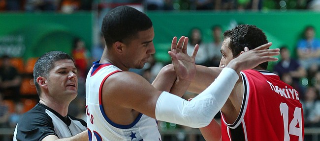 Kansas forward Landen Lucas (33) and Turkey forward MD Senli (14) position themselves against each other during a timeout in a Team USA 66-57 win against Turkey Saturday, July 4, in Gwangju, South Korea.
