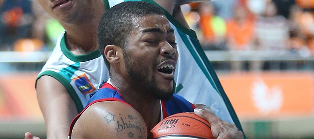 Kansas guard Frank Mason III (0) gets fouled on a drive to the basket in the first-half of a Team USA game against Brazil Sunday, July 5, in Gwangju, South Korea.