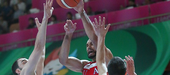 Kansas forward Perry Ellis  (34) passes out from beneath the basket in a Team USA game against Serbia Wednesday, July 8, at the World University Games in South Korea.