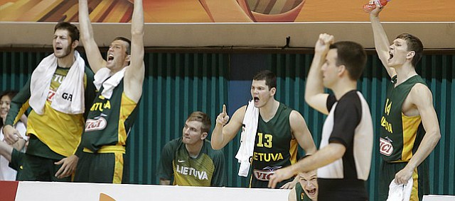 The Lithuanian team bench celebrates a late basket in the teams 74-67 win over Australia. Lithuania will play Team USA in the quarterfinals at noon Saturday in Gwangju, South Korea (10 p.m. Friday CDT). Friday’s game will be broadcast by ESPNU.

