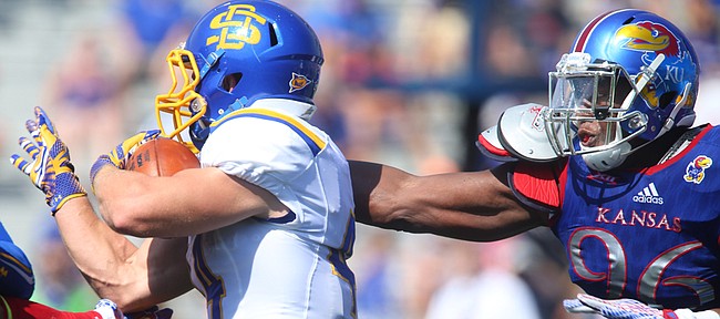 Kansas defensive tackle Daniel Wise (96) can't get a handle on South Dakota State running back Brady Mengarelli (44) as he runs in for a touchdown during the first quarter on Saturday, Sept. 5, 2015 at Memorial Stadium.