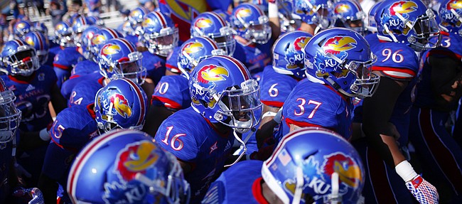 The Jayhawks pack it in tight as they prepare to rush onto the field before kickoff on Saturday, Sept. 5, 2015 at Memorial Stadium.