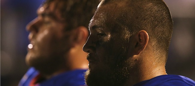 Kansas offensive lineman Jordan Shelley-Smith (79) sits on the sidelines during the Jayhawks' 55-23 loss to Memphis on Saturday, Sept. 12, 2015 at Memorial Stadium.