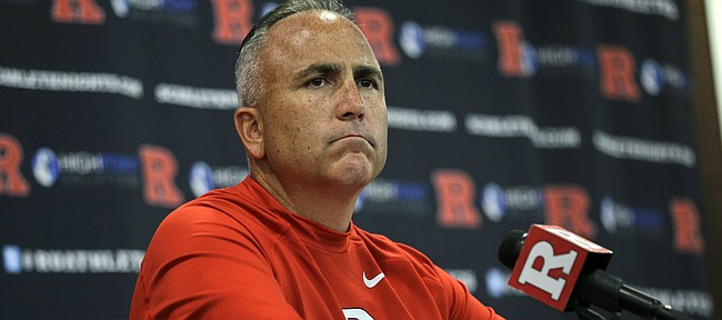 FILE - In this Saturday, Sept. 5, 2015 file photo, Rutgers head coach Kyle Flood listens to a question as he addresses the media after his team defeated Norfolk State, 63-13 in an NCAA college football game in Piscataway, N.J. Rutgers has suspended football coach Kyle Flood for three games after he contacted a faculty member over a player’s status. Rutgers President Robert Barchi announced the punishment Wednesday afternoon, Sept. 16, 2015, a day after he said he received an internal investigative report. (AP Photo/Mel Evans, File)