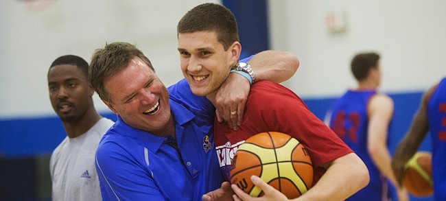 KU coach Bill Self, left, jokes with Svi Mykhailiuk as Self said he hadn't seen Svi for a while, just before camp on Tuesday, June 9, 2015.