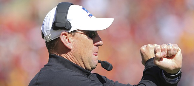 Kansas head coach David Beaty gives a signal to his players during the fourth quarter on Saturday, Oct. 3, 2015 at Jack Trice Stadium in Ames, Iowa.