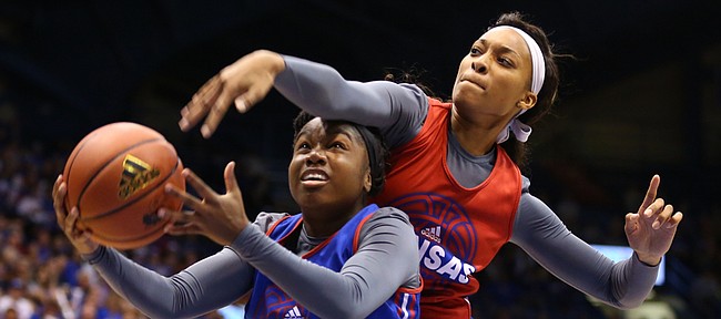 Blue Team guard Jayde Christopher is fouled by Red team center Caelynn Manning Allen during Late Night in the Phog, Friday, Oct. 9, 2015 at Allen Fieldhouse.