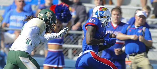 Kansas wide receiver Steven Sims Jr. (16) runs in the Jayhawks' lone touchdown past Baylor cornerback Tion Wright (3) during the first quarter on Saturday, Oct. 10, 2015 at Memorial Stadium.