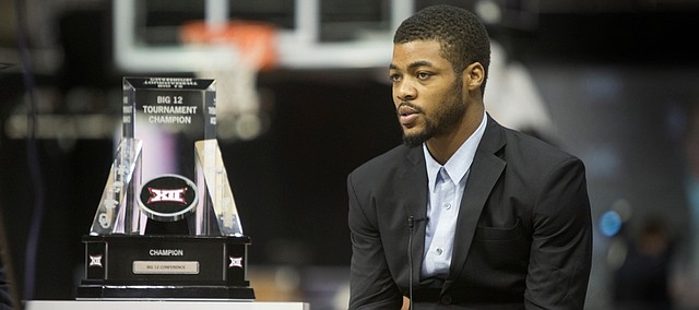 KU junior Frank Mason sits next to the Big 12 Trophy as he was being interview during   Big 12 Media Day Tuesday Oct. 20, 2015 at the Sprint Center.