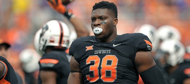 Oklahoma State defensive end Emmanuel Ogbah stands on the sideline before the OSU-Kansas State game Oct. 3 in Stillwater, Oklahoma. Ogbah leads the Big 12 in sacks per game.