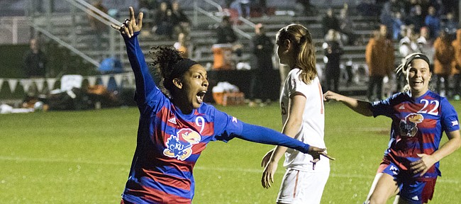 Kansas senior Ashley Williams (9) and freshman Parker Roberts (22) celebrate Williams' first half goal against Texas during their Big 12 tournament soccer match at Swope Park Soccer Village in Kansas City, Mo. on Wednesday night.