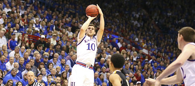Kansas guard Sviatoslav Mykhailiuk (10) pulls up for a three over Fort Hays State guard Aaron Nicholson (1)  during the second half, Tuesday, Nov. 10, 2015 at Allen Fieldhouse.