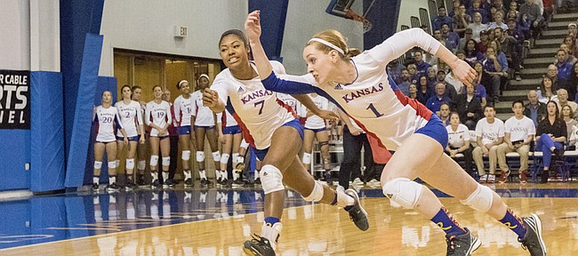 Kansas' Anna Church (1) and Tiana Dockery (7) try to chase down the ball during their volleyball match against Texas Wednesday evening at the Horejsi Center. The Jayhawks fell to the Longhorns in five sets. Kansas only has two losses on the season with both coming at the hands of Texas. 