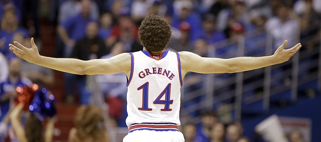 Kansas guard Brannen Greene (14) throws his arms up after capping off a string of three against Northern Colorado during the second half, Friday, Nov. 13, 2015 at Allen Fieldhouse.