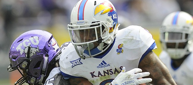 Kansas' Fish Smithson (9) comes up with a interception in the second half of the Jayhawks' 23-17 loss to TCU on Saturday, Nov. 14, 2015, in Fort Worth, Texas.