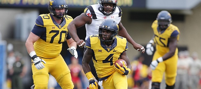 West Virginia running back Wendell Smallwood breaks into the secondary during the Mountaineers’ 45-6 win over Maryland on Sept. 26 in Morgantown, West Virginia.