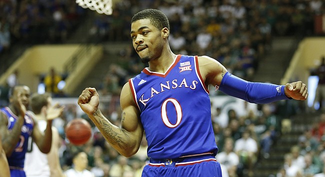 Kansas guard Frank Mason III (0) pumps his fist after a bucket and a Michigan State foul during the first half on Sunday, Nov. 30, 2014 at the HP Field House in Kissimmee, Florida.