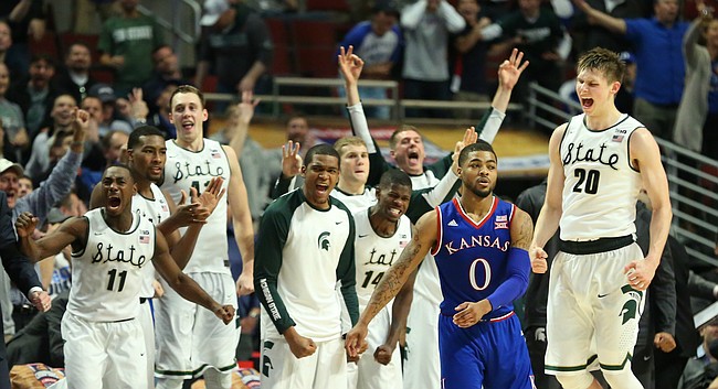 The Michigan State bench goes crazy after Michigan State guard Matt McQuaid (20) hit a late three-pointer over Kansas guard Frank Mason III (0) during the second half, Tuesday, Nov. 17, 2015 at United Center in Chicago.