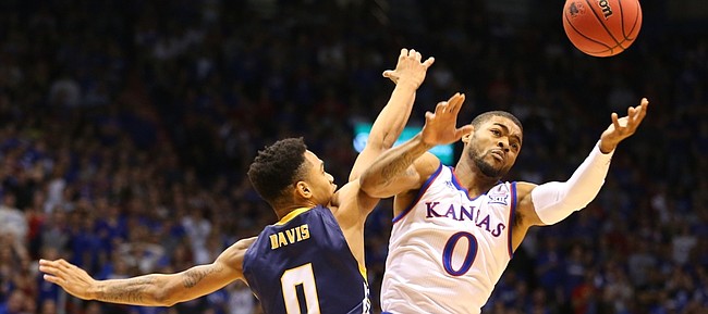 Kansas University junior guard Frank Mason III leaps for a loose ball in the opening minutes of the Jayhawks' season opener against Northern Colorado, on Nov. 13, 2015, at Allen Fieldhouse.