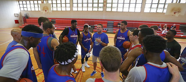 Members of Kansas men's basketball team huddle around head coach Bill Self as he gives a talk prior to a practice, Saturday, Nov. 21, 2015 at Lahainaluna High School in Lahaina, Maui. Freshman Cheick Diallo did not practice as he has yet to be cleared to participate in team practices on the road by the NCAA.