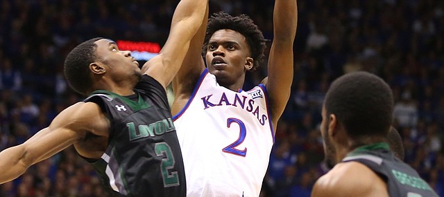 Kansas guard Lagerald Vick (2) pulls up for a jumper against Loyola guard Andre Walker (2) during the second half, Tuesday, Dec. 1, 2015 at Allen Fieldhouse.