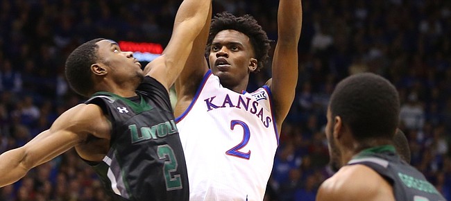 Kansas guard Lagerald Vick (2) pulls up for a jumper against Loyola guard Andre Walker (2) during the second half, Tuesday, Dec. 1, 2015 at Allen Fieldhouse.