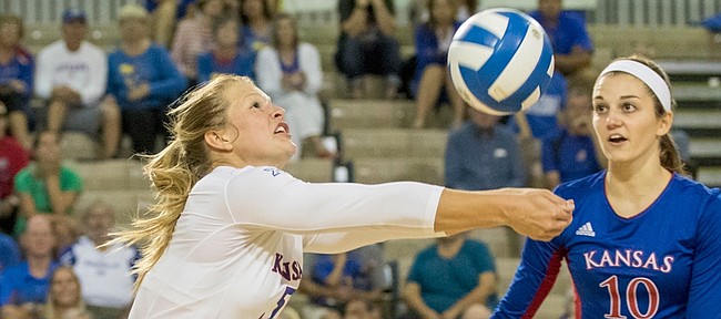 Kansas University libero Cassie Wait makes a dig in front of teammate Tayler Soucie (10) during their volleyball match against Western Illinois in the Jayhawk Invitational Tournament on Sept. 4 at the Horejsi Center. Juniors Wait, from Gardner, and Soucie, from Osawatomie, give the Jayhawks’ rotation a Kansas flavor.