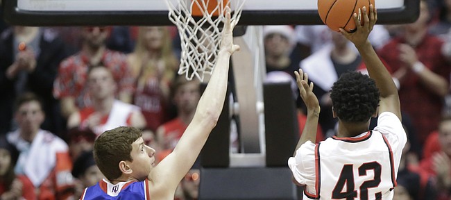 Kansas forward Hunter Mickelson (42) looks to block a shot from San Diego State guard Jeremy Hemsley (42) during the first half, Tuesday, Dec. 22, 2015 at Viejas Arena in San Diego.